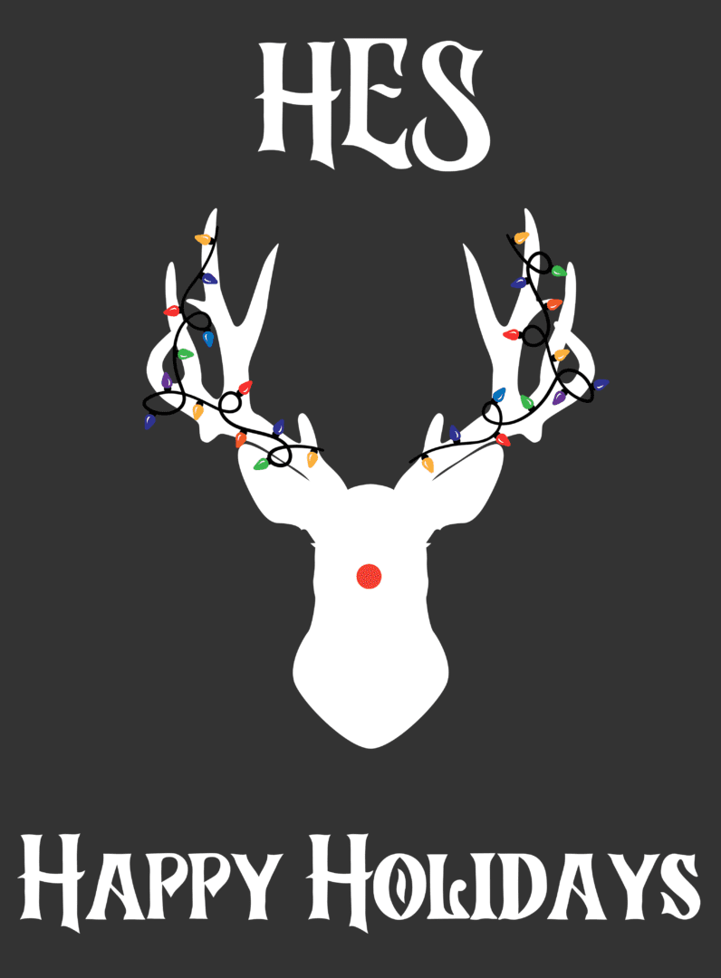 A white deer with christmas lights on it's antlers.